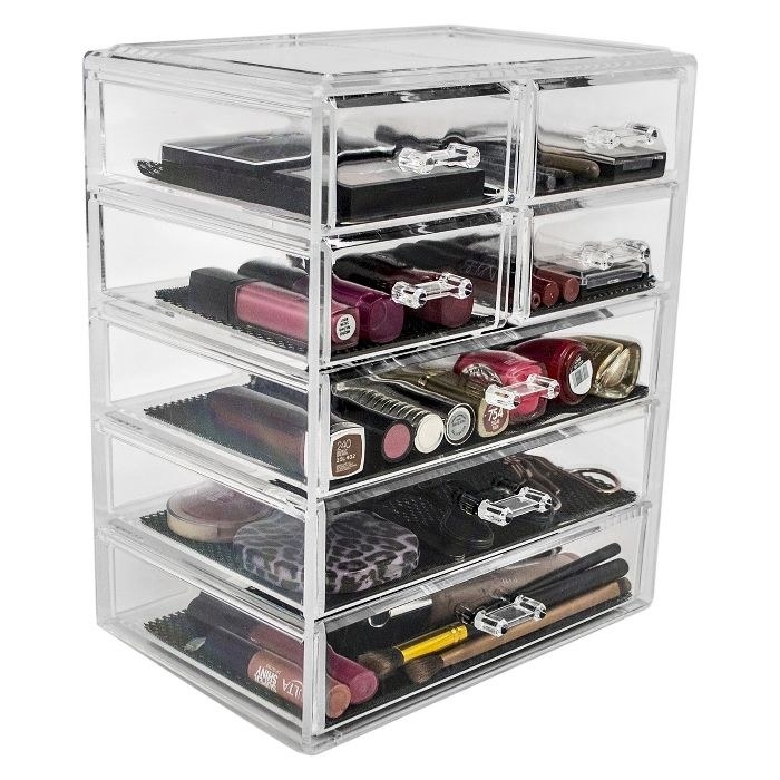 The clear, seven drawer organizer filled with makeup