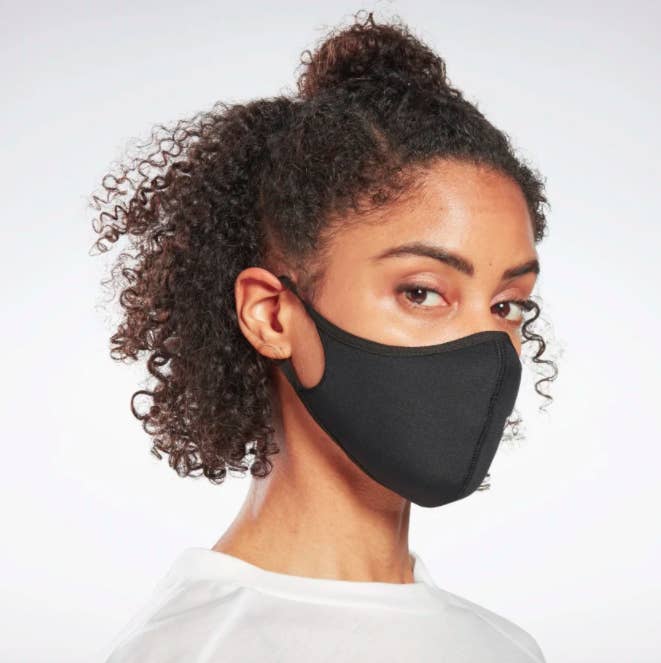 A model wearing the Reebok face covering. 