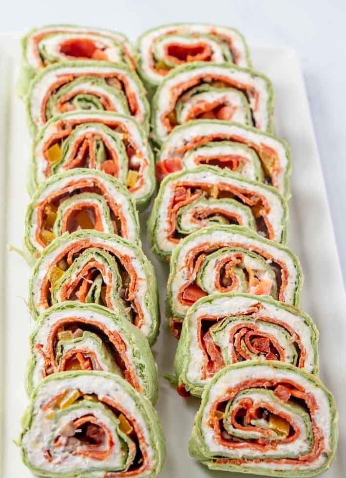 Pinwheel sandwiches filled with pepperoni, peppers, mozzarella, and cream cheese.