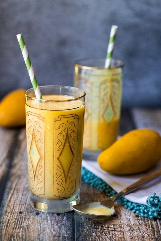 Image of two glasses of mango lassi