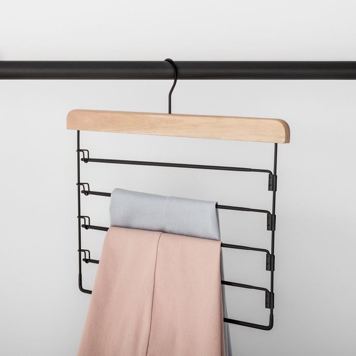 The five bar hanger holding two pairs of dress pants