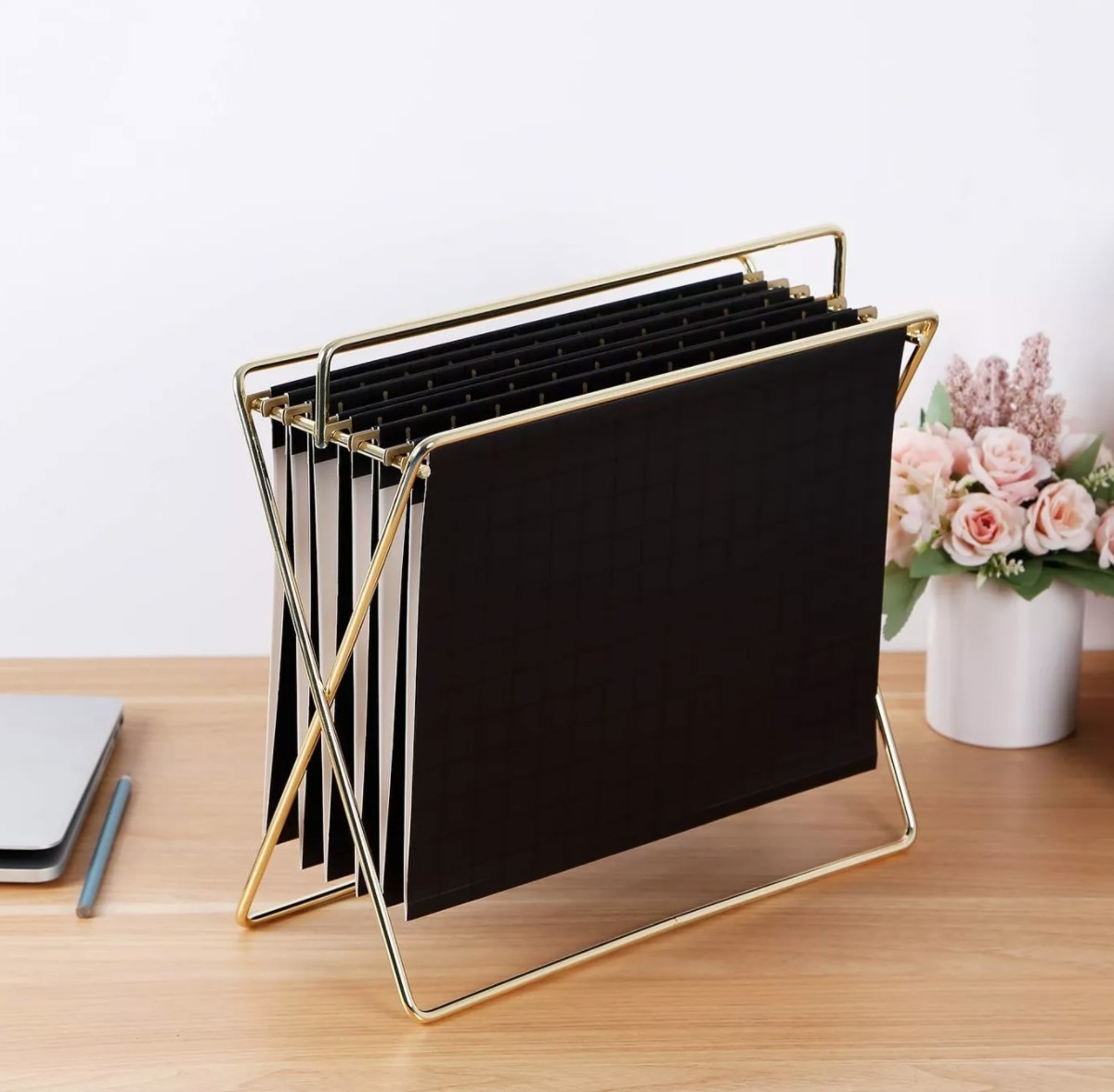 A black hanging file in the gold holder 