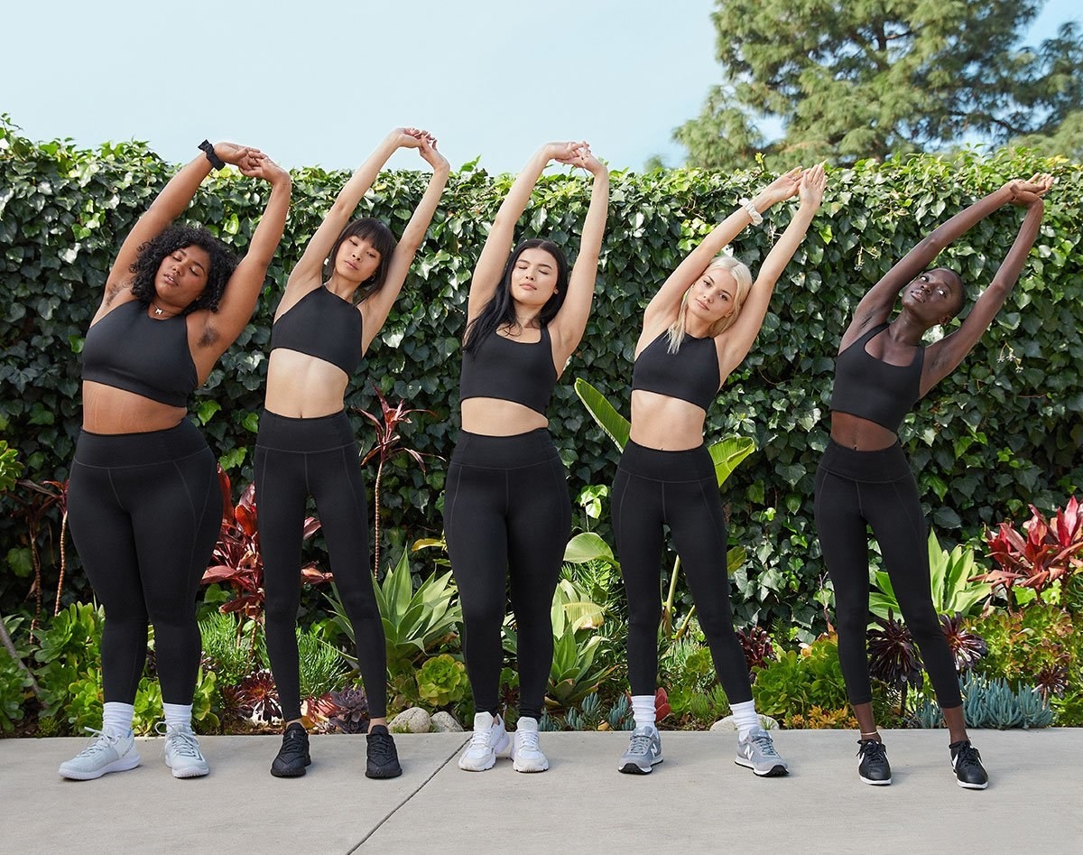 Lineup of models of different sizes and skin tones wearing the leggings