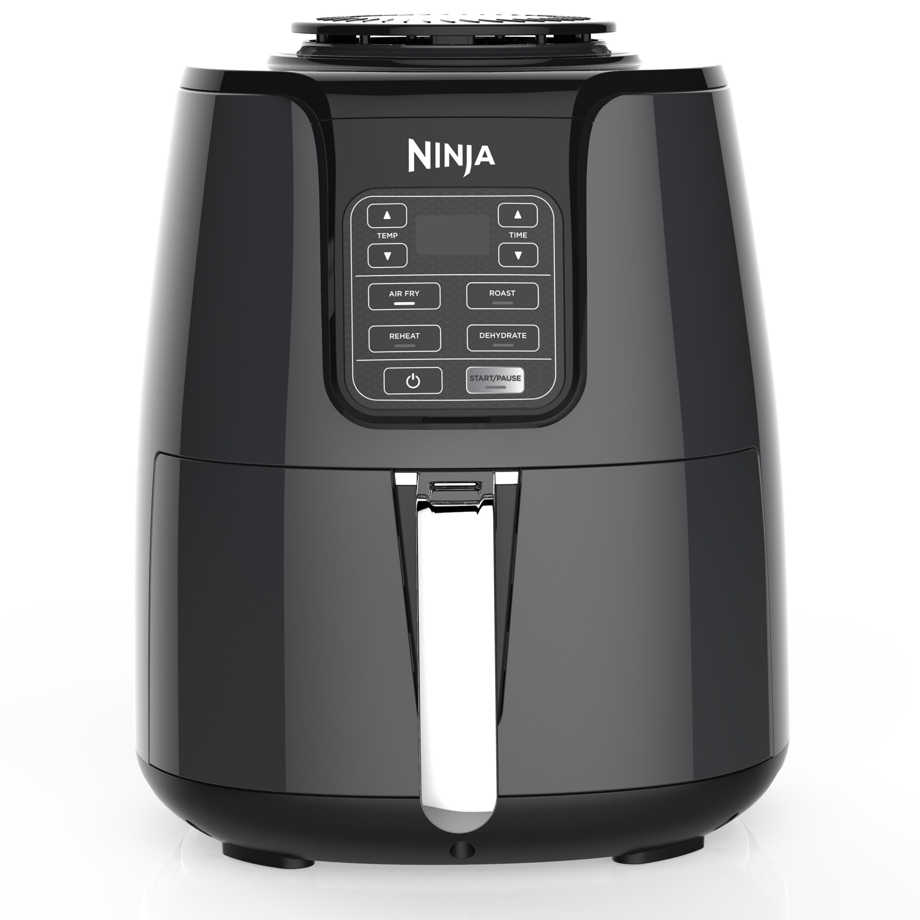 The air fryer, featuring a digital timer, pre-set buttons, and a handle for the cooking basket