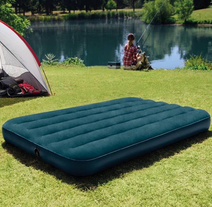 The air mattress on grass outside