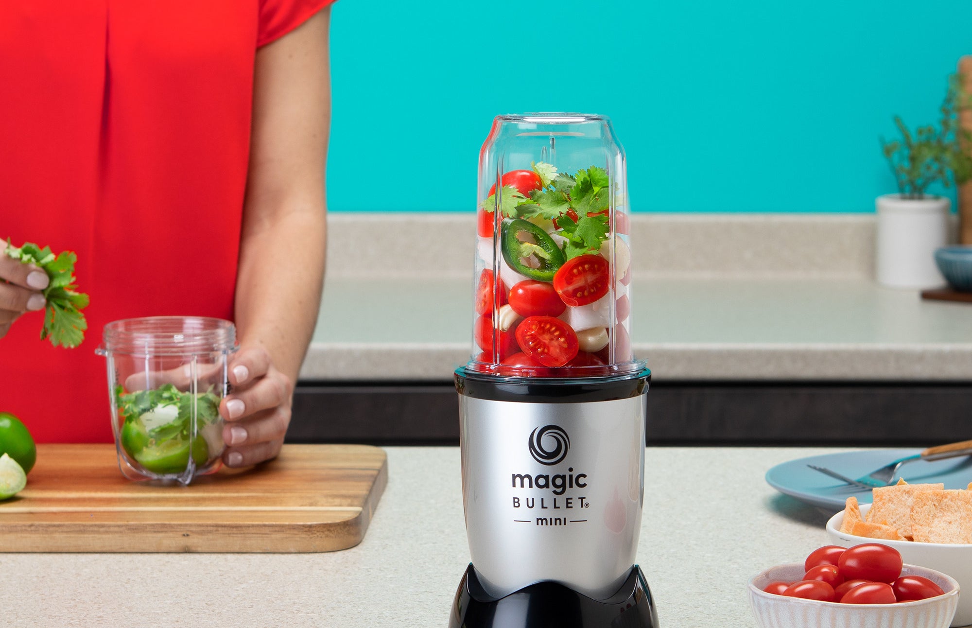 a silver and black magic bullet blending machine