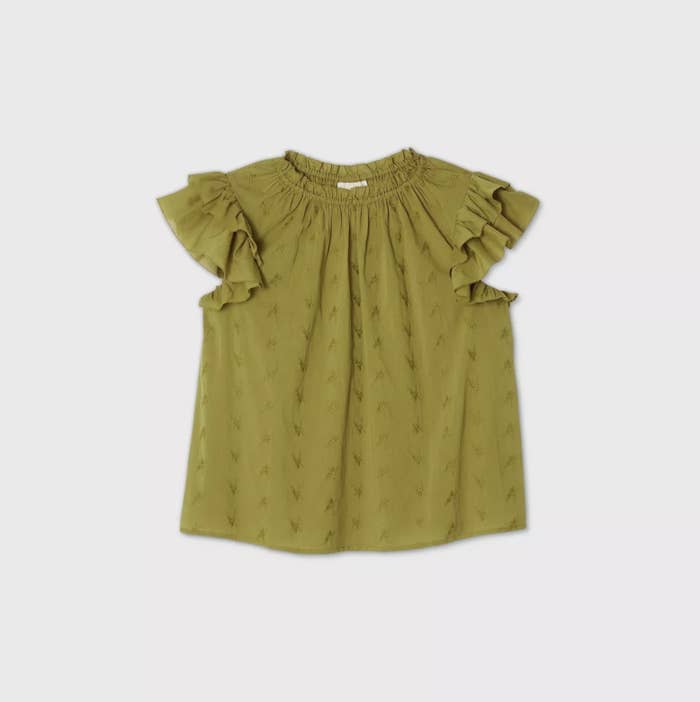 An image of an olive green blouse with ruffled short sleeves, a cinched neckline, and embroidered flowers all throughout in the same color as the fabric