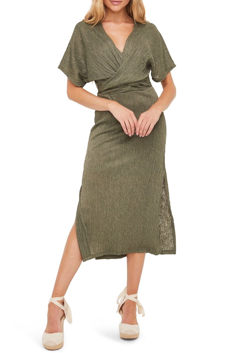 A model wears the All in Favor Phoebe V-Neck midi dress in olive