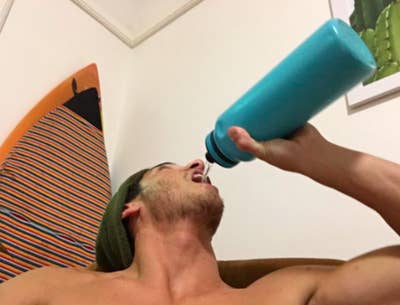 Reviewer photo of person drinking out of Tayeka Original teal water bottle 