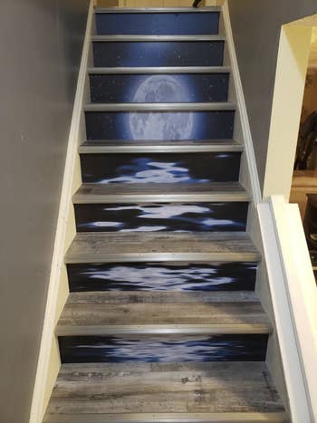 a reviewer's staircase with another version of the stickers that creates one big moonlight over ocean water scene