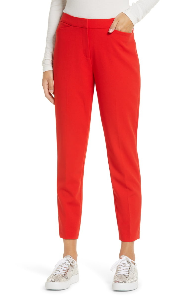 A closeup of the Halogen crop straight leg pants in red bloom on a model