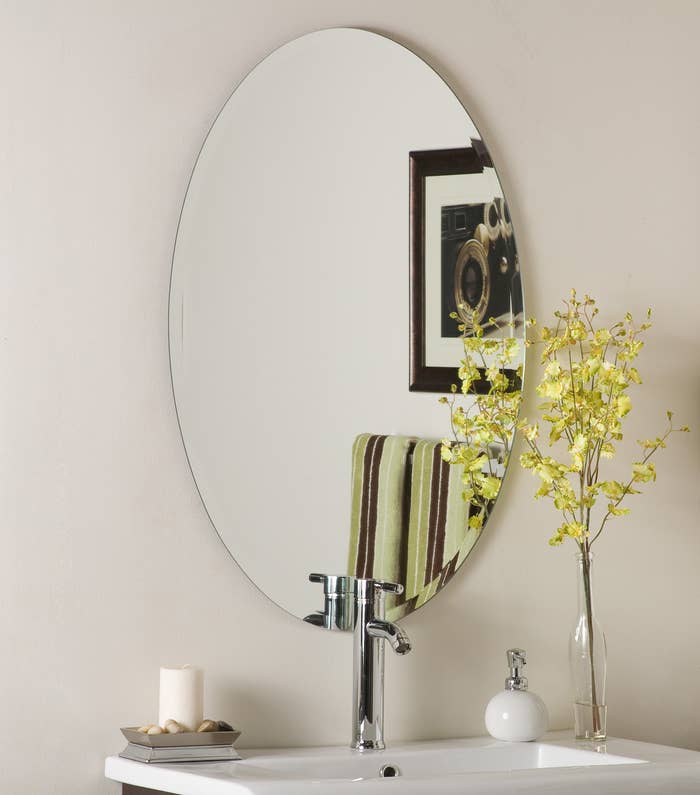 The large oval mirror