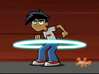 Danny Phantom transforms from blue jeans and a white t-shirt to his black and silver suit. His blue eyes becoming green.