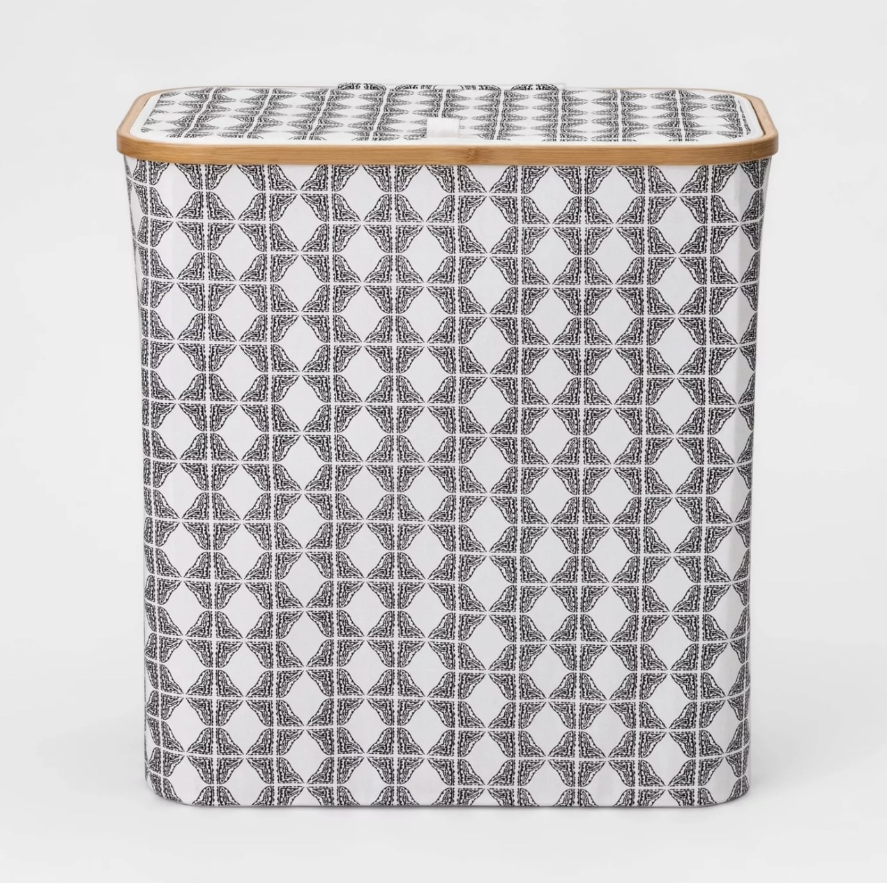 A wide hamper with a black-and-white pattern and a bamboo rim