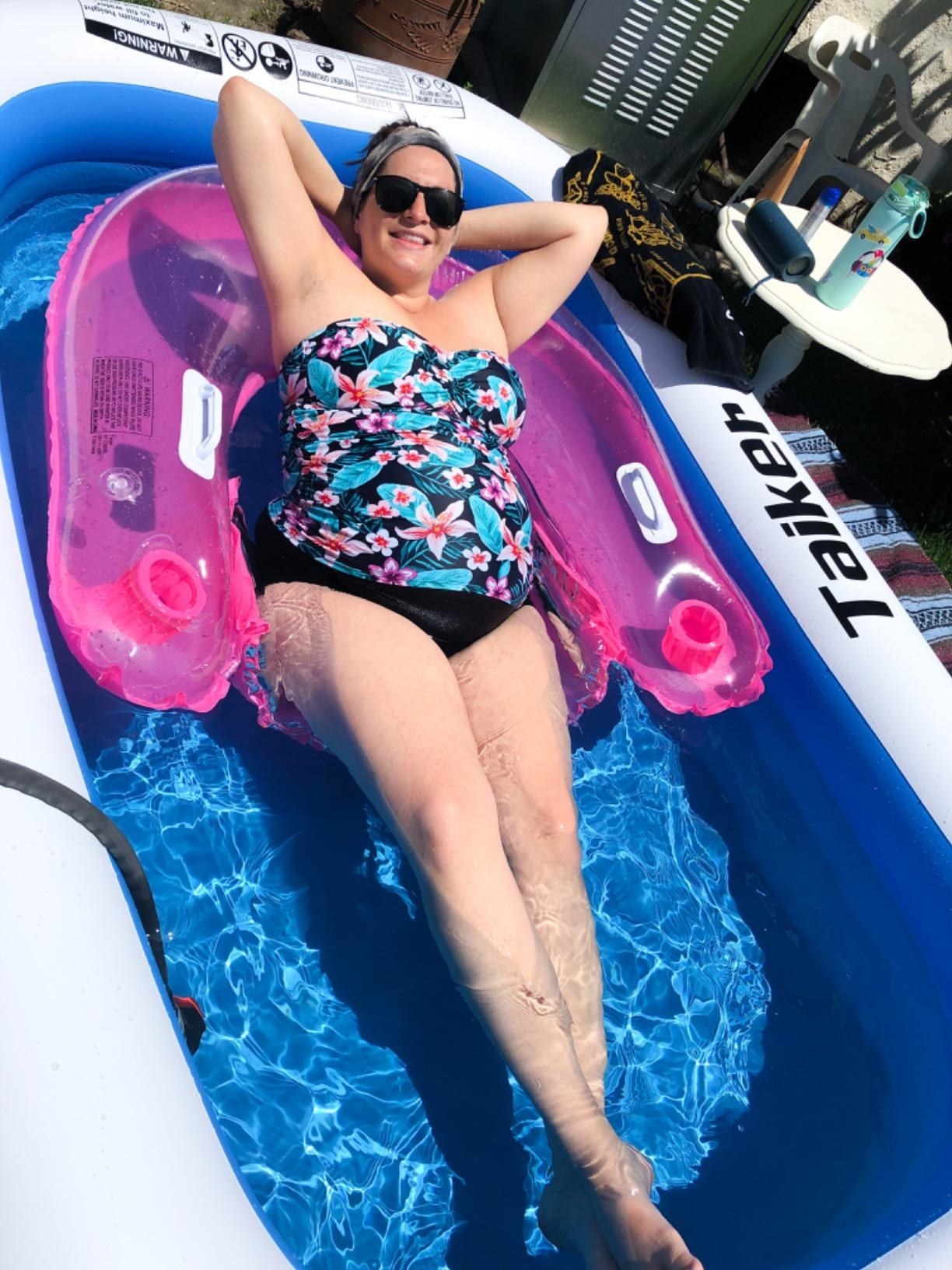 An adult reviewer reclines in the pool with a float; they&#x27;re about as tall as the pool is long