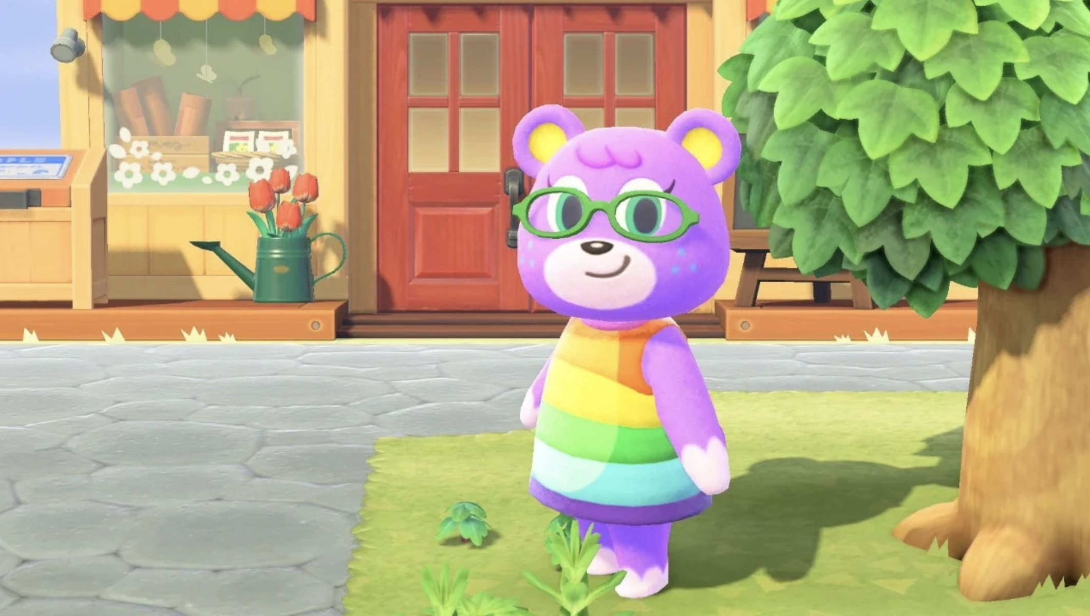 Megan wears a cute pair of rounded glasses and smiles in front of Nook&#x27;s Cranny