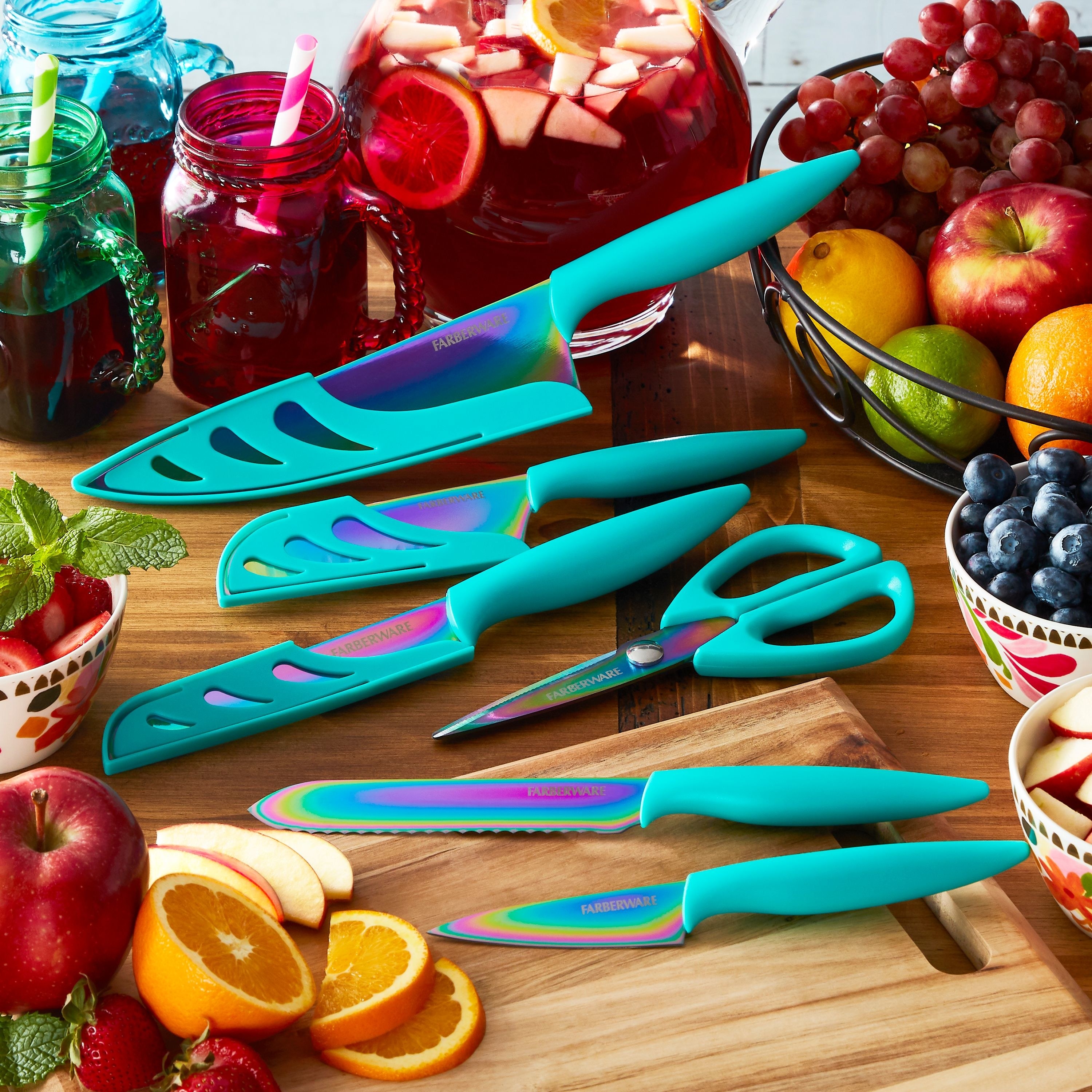 The knife set in teal with blade covers