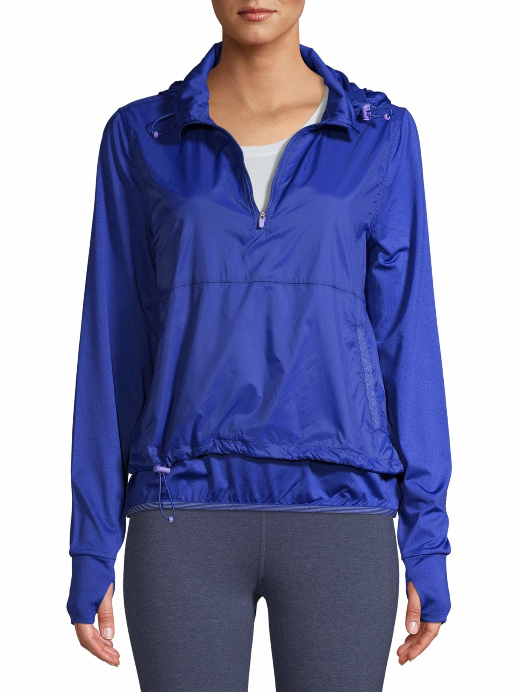 Model wearing the hoodie in the color Blue Glass, featuring a front quarter zip and thumb holes