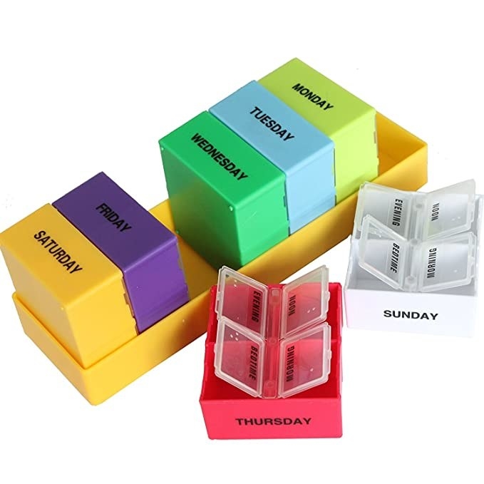 Medicine organiser with day of the week markers for different containers.