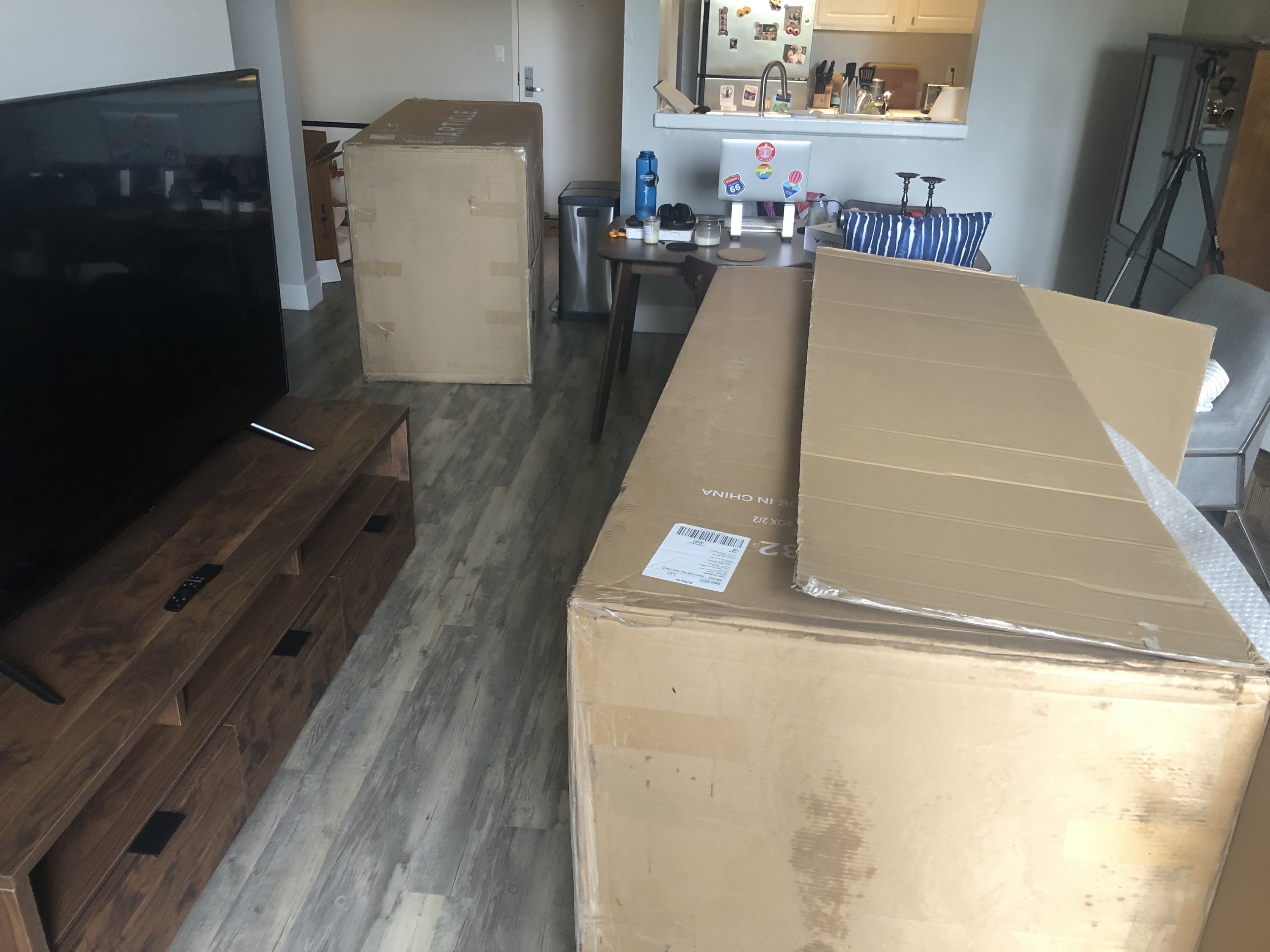 Photo of two large boxes in living room.