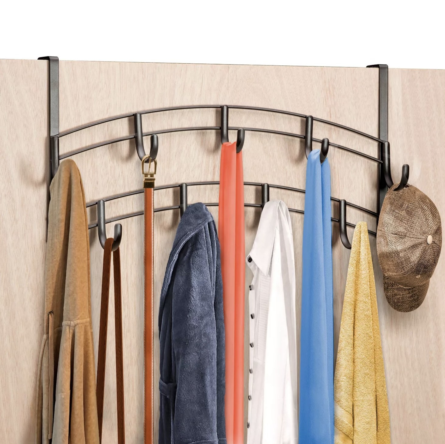 An over-the-door rack with nine hooks arranged in an arc that are holding two shirts, two scarves, a sweater, a towel, a hat, a belt, and a purse.