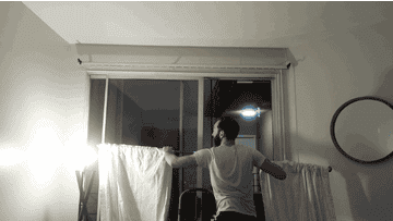 GIF of me trying to put the curtains up.