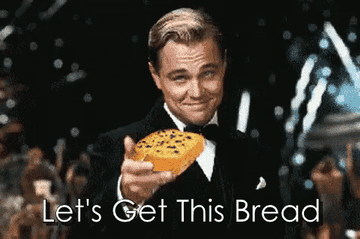 A gif of Leonardo Dicaprio lifting a piece of bread and the caption &quot;Let&#x27;s Get This Bread&quot;