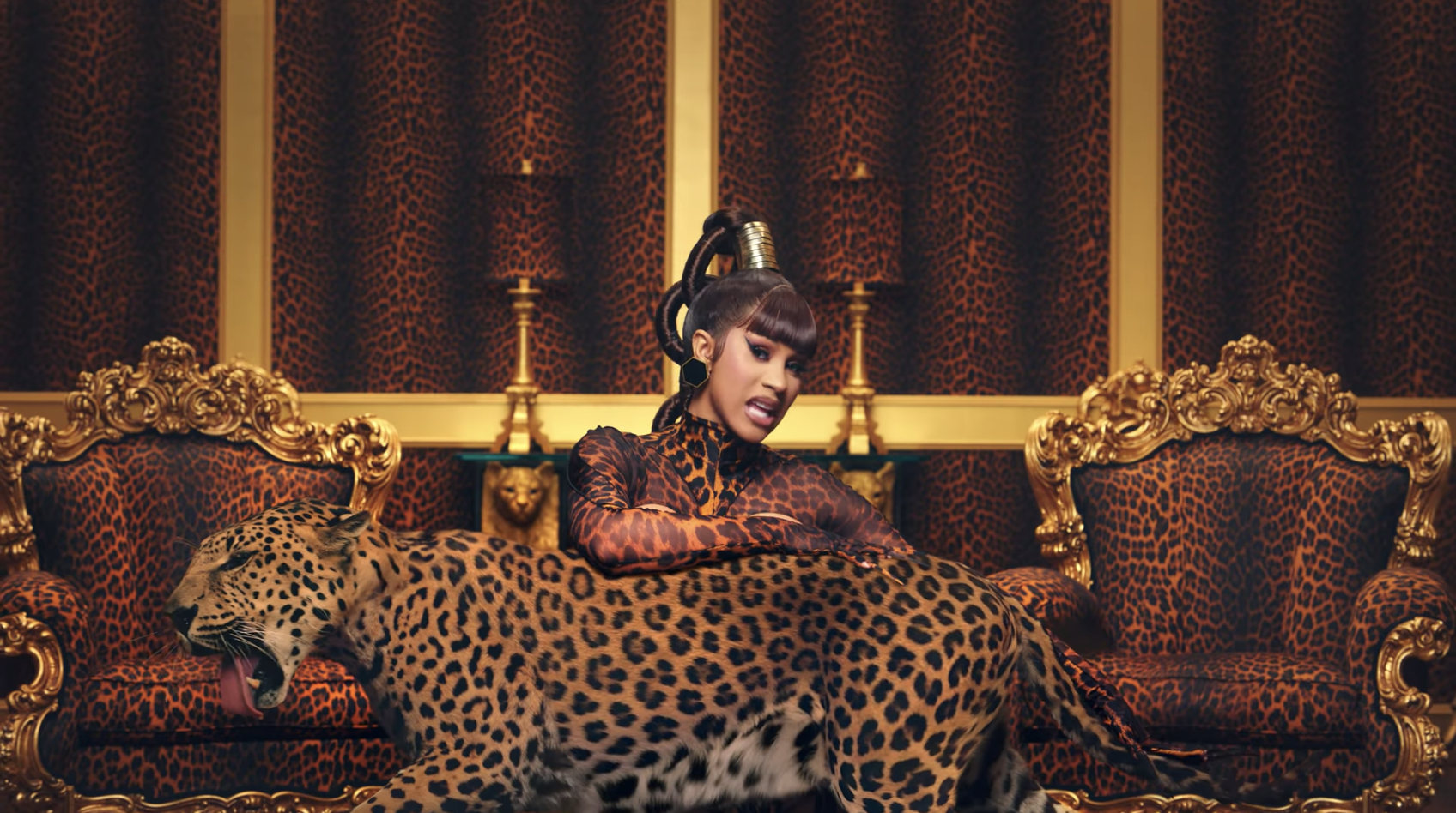 Cardi B posing with leopards, which were included in the &quot;WAP&quot; video via green screen