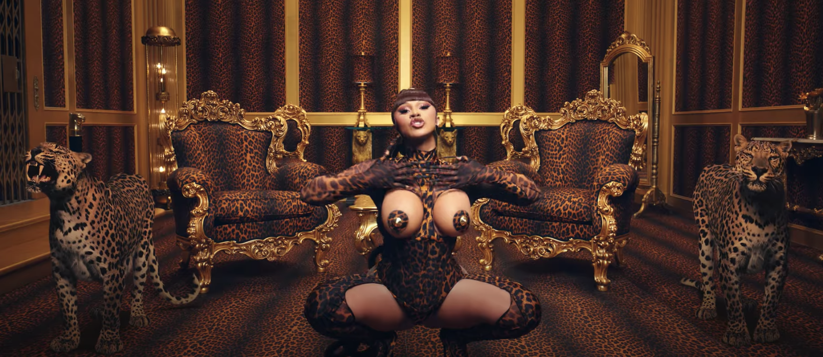 Cardi B posing with leopards, which were included in the &quot;WAP&quot; video via green screen