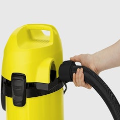 A yellow vacuum cleaner closeup