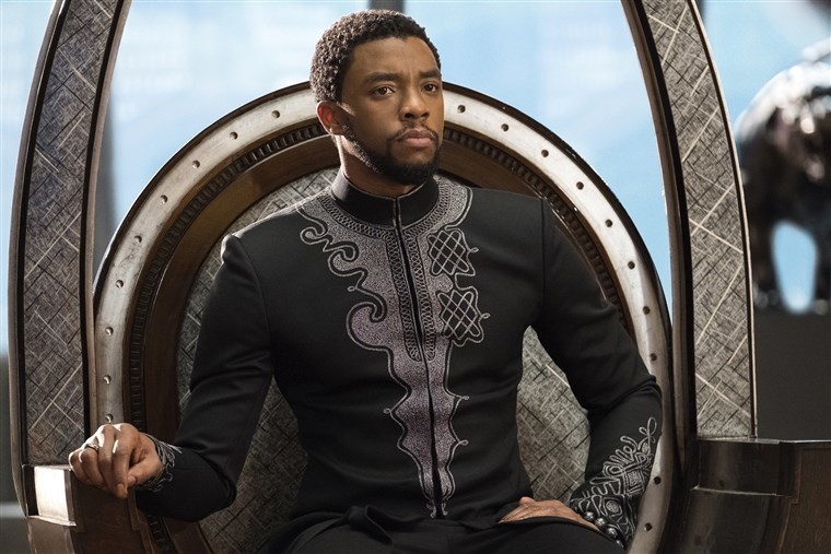 Chadwick Boseman playing T&#x27;Challa in &quot;Black Panther&quot;; he is sitting on a throne