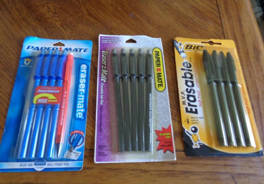 A two Paper-Mate packs of erasable pens and one pack of BIC erasable pens