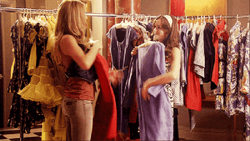 Serena and Blair from &quot;Gossip Girl&quot; shopping and holding up cute dresses