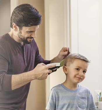 A model trimming a child's hair