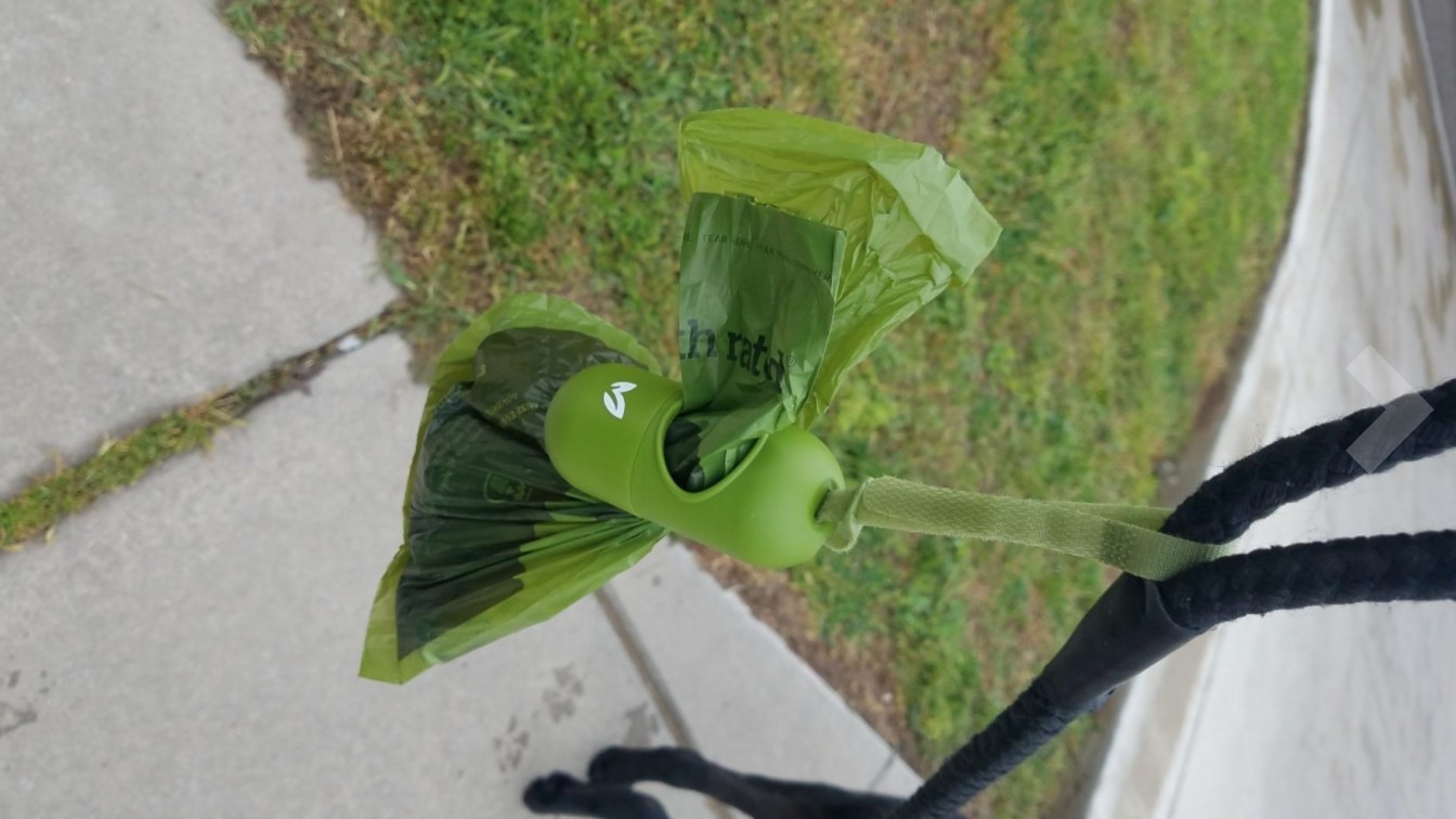 Reviewer&#x27;s image of the waste bags attached to the leash dispenser 