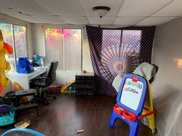 A mom&#x27;s at-home school setup for her young son — which includes a desk and art easel with magnets. 
