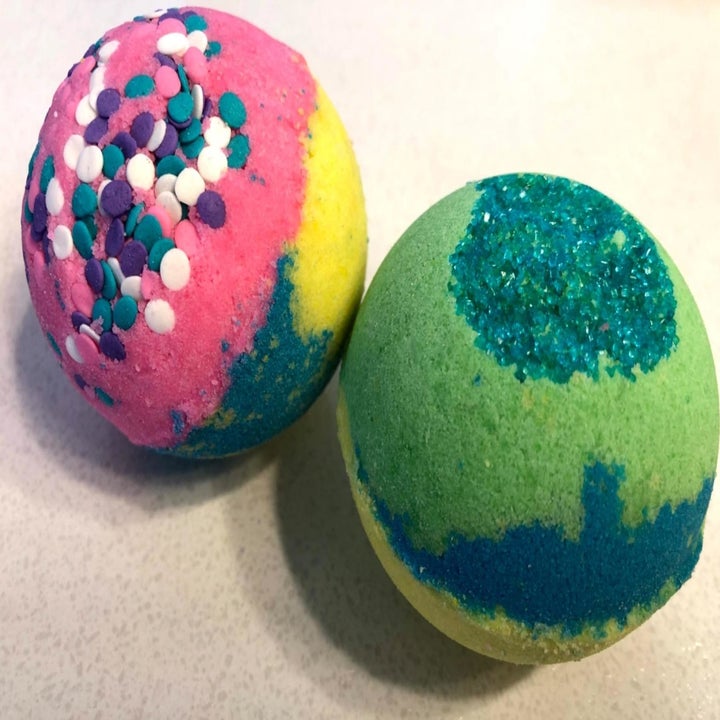 reviewer's diy bath bombs in various bright colors 