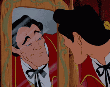Gaston making faces in the mirror.
