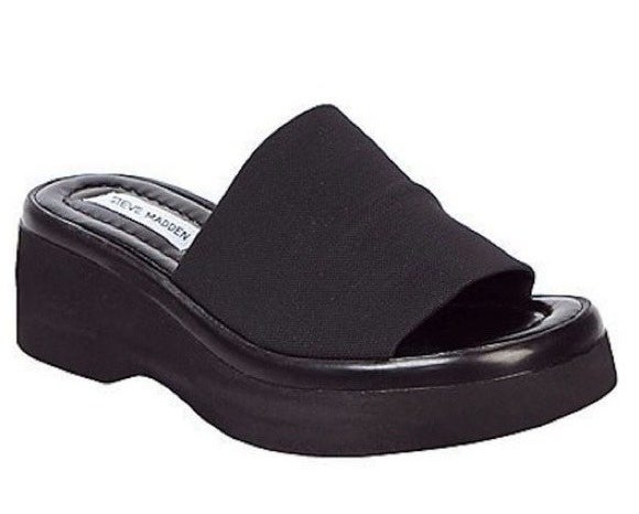 A black platformed Steve Madden slide sandal