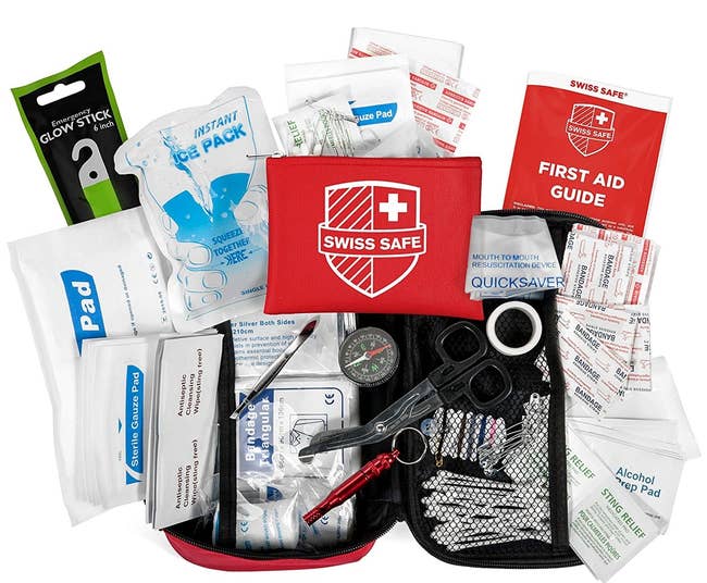 A Swiss Safe First Aid Kit that zips open into two halves with mesh components that hold all of the medical pieces