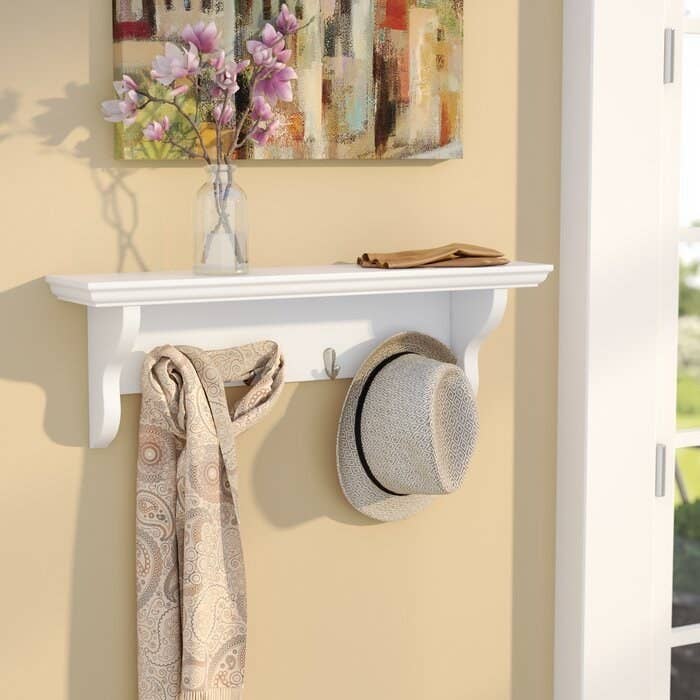 The white wall mount in an entryway
