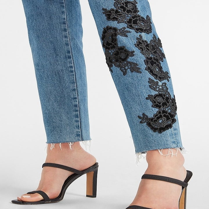 A close up on the black floral lace detail