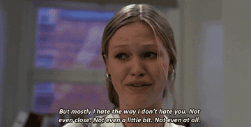 Kat reciting her love-hate prom about Patrick to the class. 