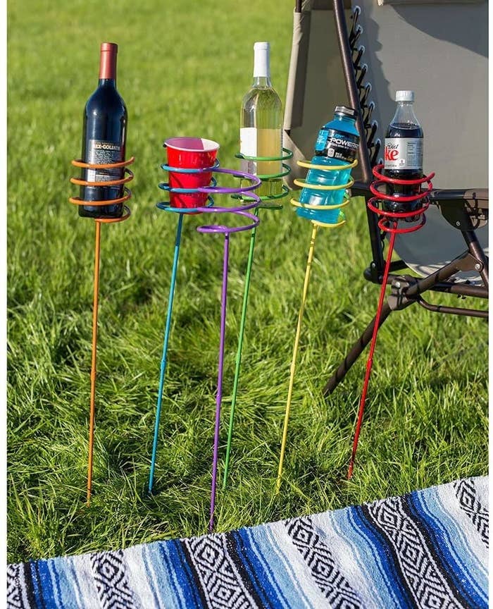 The set of six colored stakes holding full-size wine bottles, soda bottles, and Solo cups