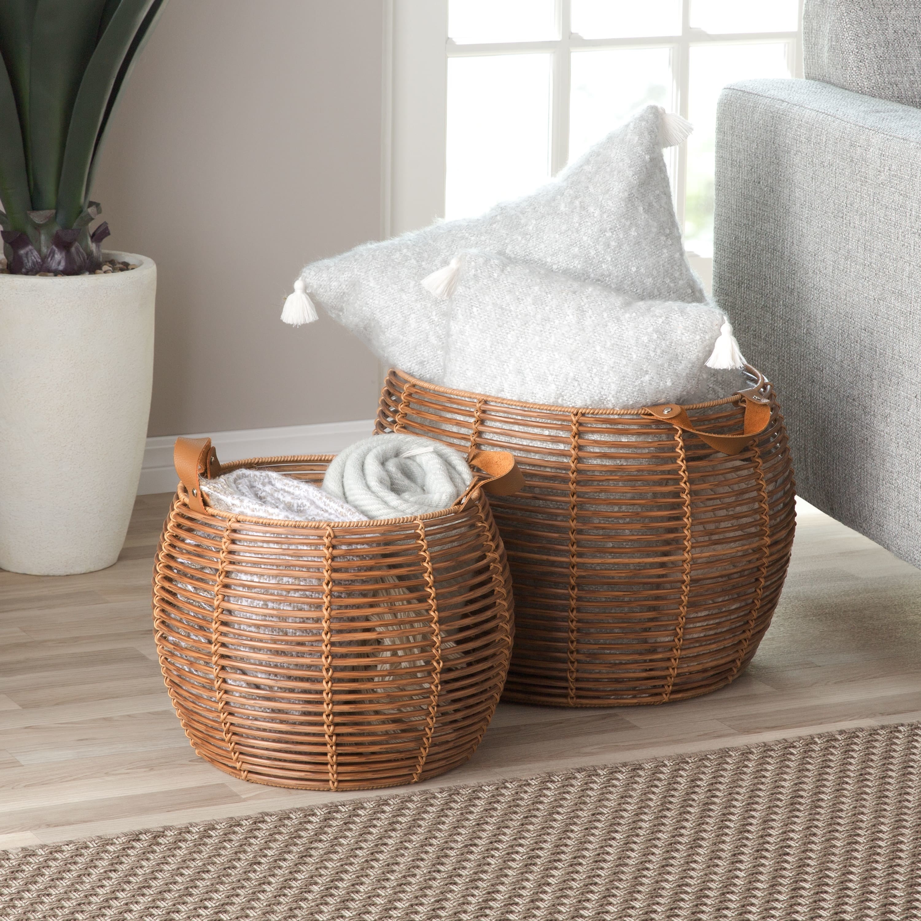 Two woven medium wood rattan baskets 