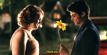 Jamey giving Sierra a sunflower. 