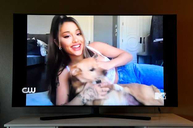 Ariana Grande playing with her dog on-screen