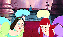 Ugly step sisters make an ugly face, while Cinderella wanders into the ball in the back