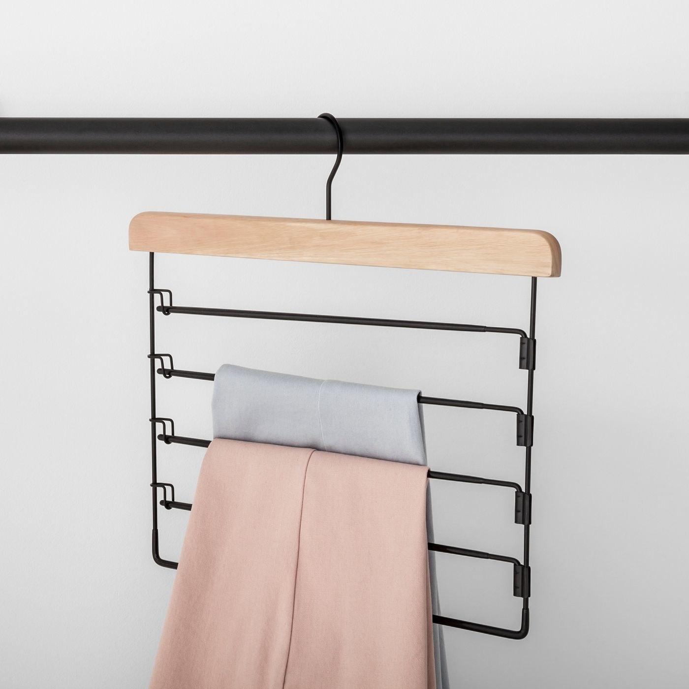Pants hanger with two pairs of pants on it