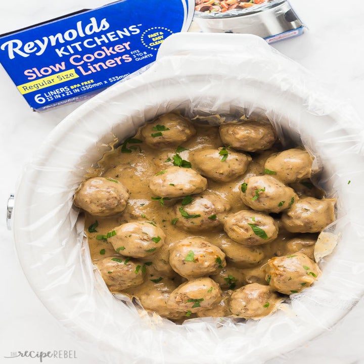 Swedish meatballs in gravy in a lined slow cooker.